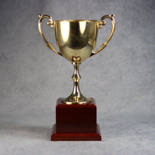 Gold Metal Cup On Rosewood Base